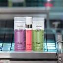 Cosmetic products moving on a packaging conveyor belt