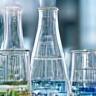 Beakers and lab equipment showing cosmetic formulation process